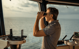 Man looking through binoculars
