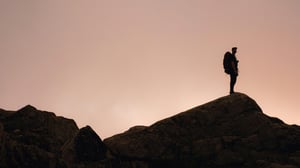 Person climbing mountain