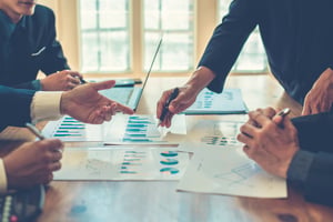 business-professionals-discussing-charts-in-boardr-2026-01-08-06-50-01-utc