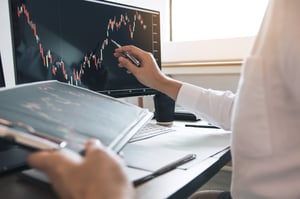 investor-man-analyzing-the-graph-of-the-stock-mark-2026-01-07-00-40-15-utc